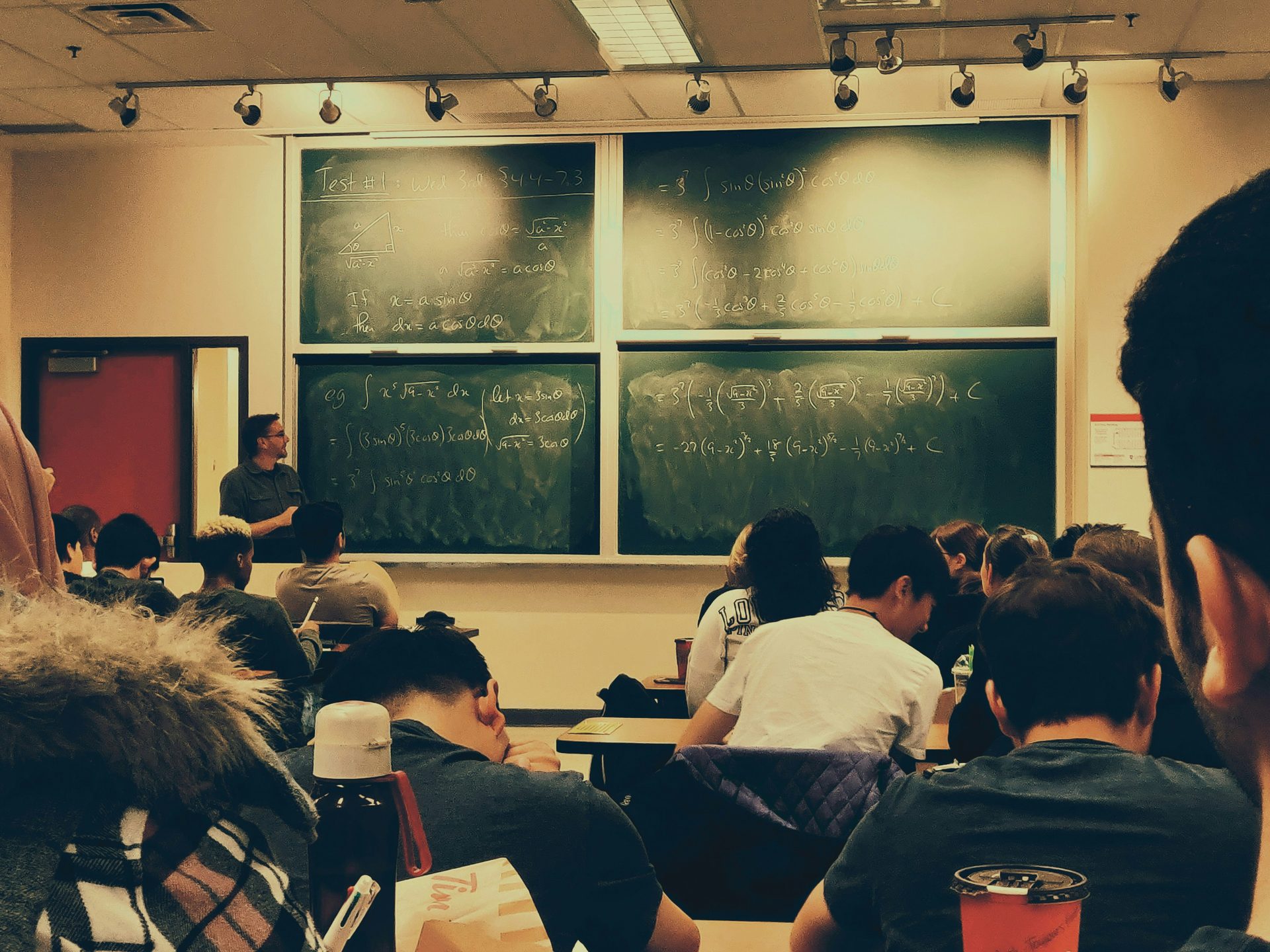 Student studying with intense focus in a structured environment